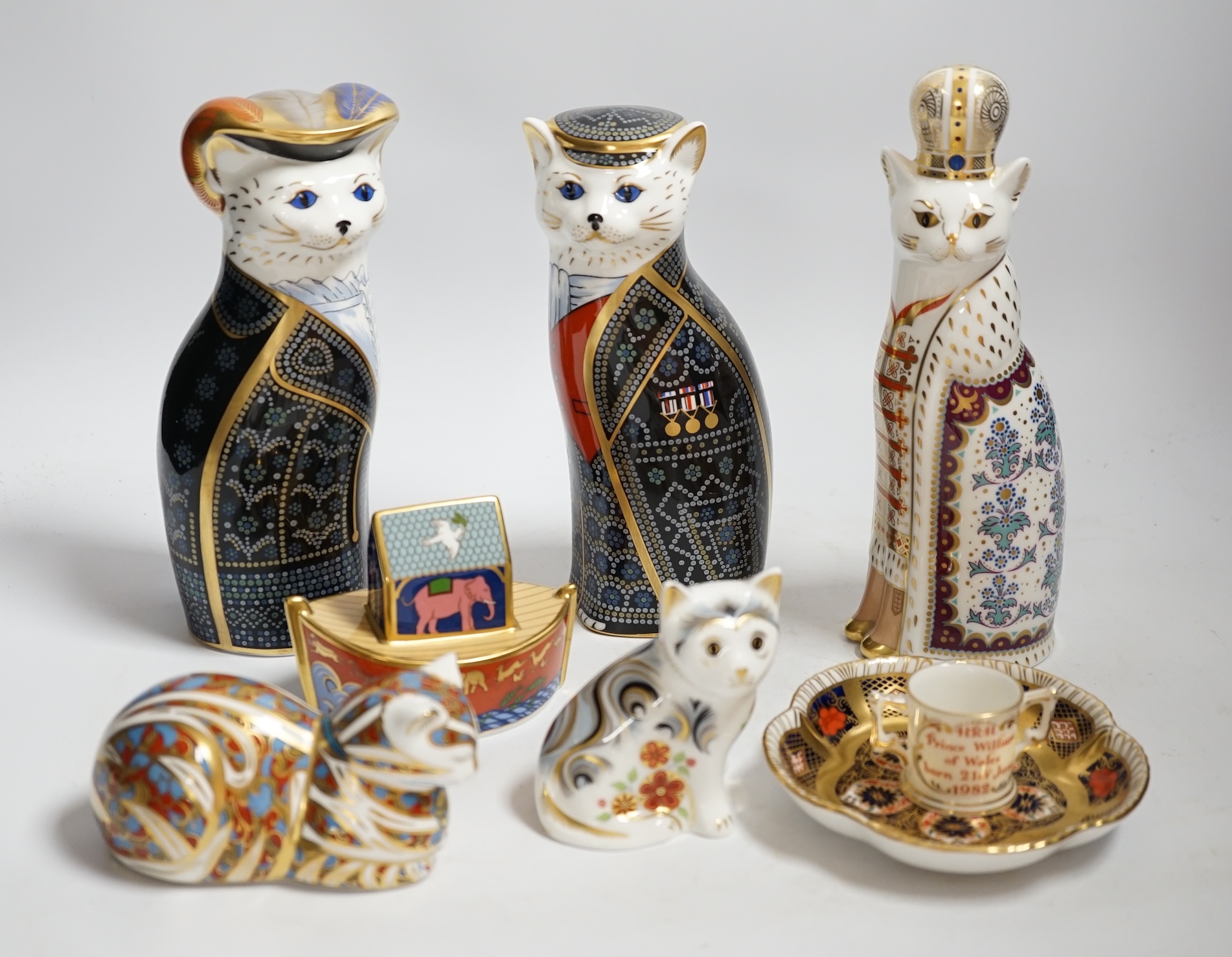 A collection of Royal Crown Derby porcelain and paperweights including Pearly Queen, Pearly King, Russian, etc.